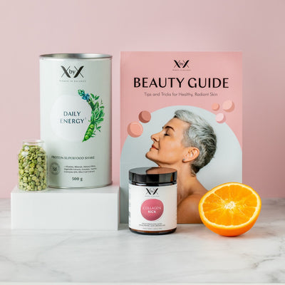 Mood image of XbyX Beauty Bundle that includes XbyX Daily Energy vegan Protein Superfood Powder, XbyX Collagen Kick product, a vegetarian collagen powder from eggshell membranes and the XbyX Beauty Guide